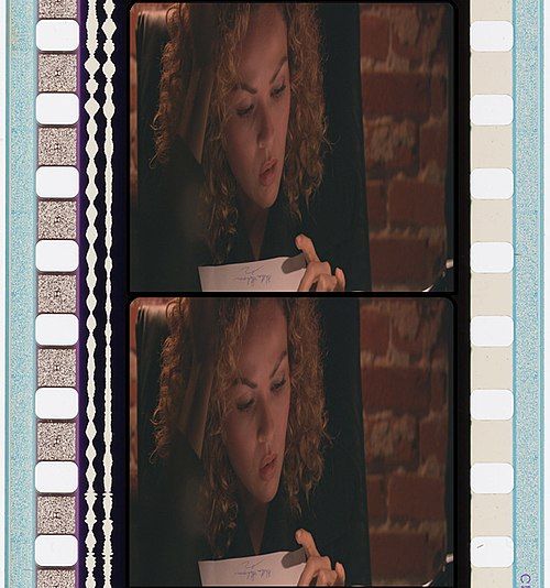 An image of two frames of 35mm film, with optical sound in waveforms to the left